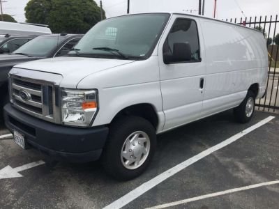 Ford E-150 rental car parked on street